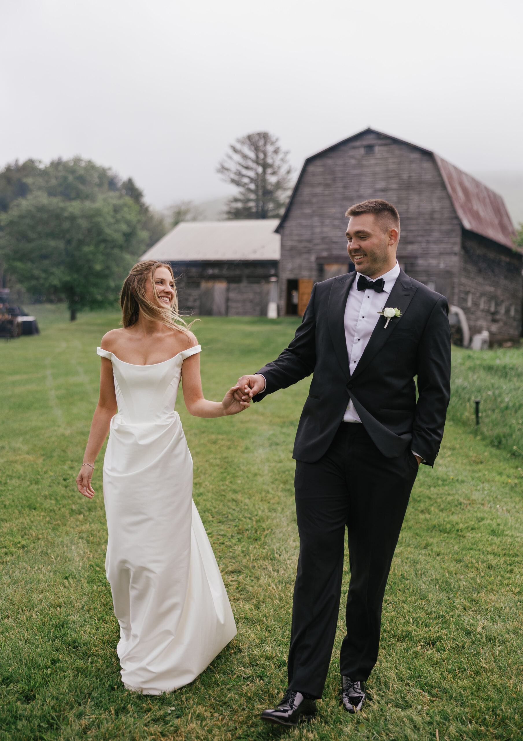 bride and groom holding hands and smiling