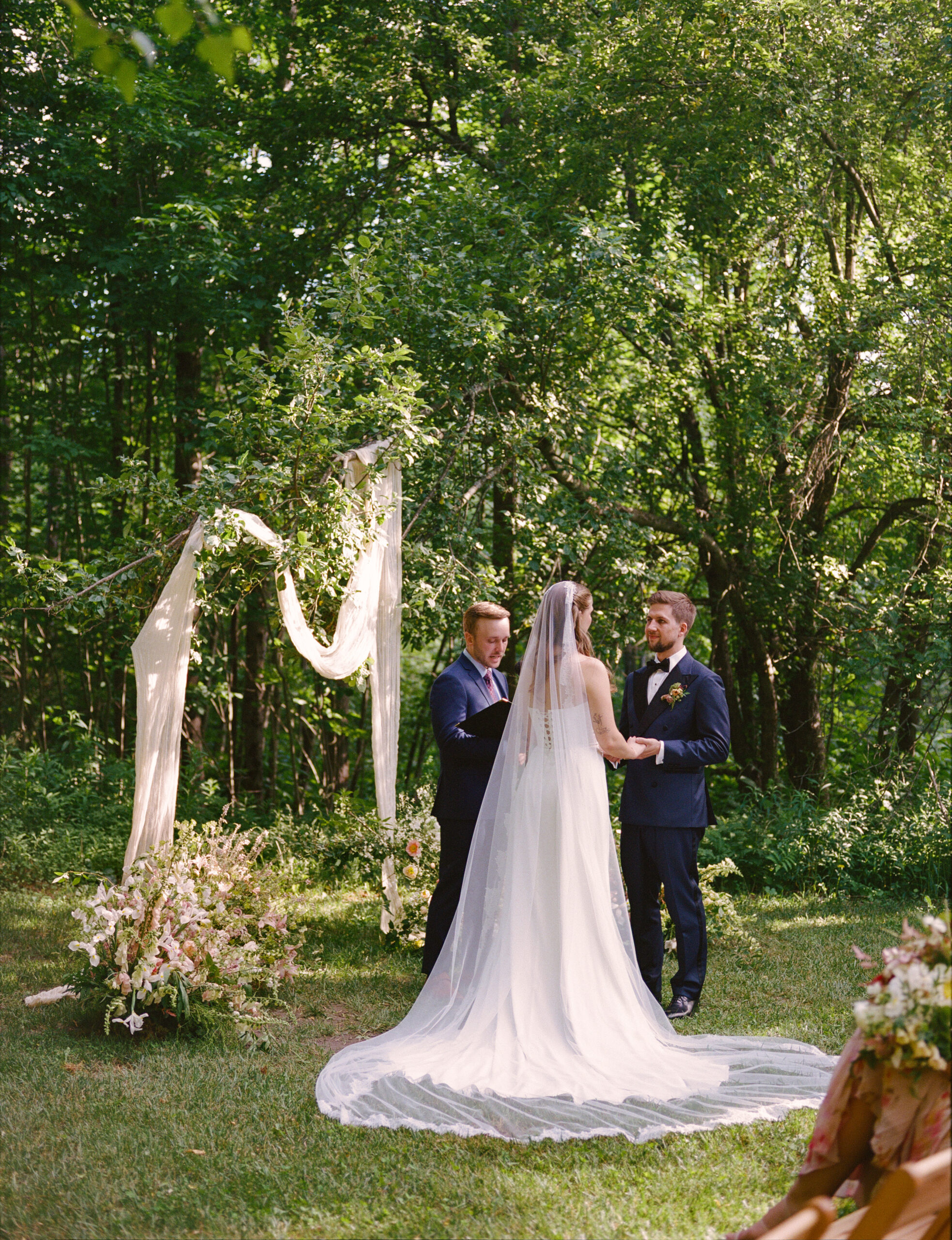 the vows under a canopy of trees